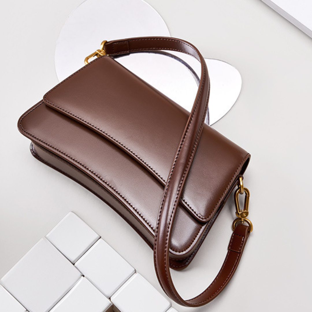 <tc>Bolso bandolera Britney de cuero liso</tc>
