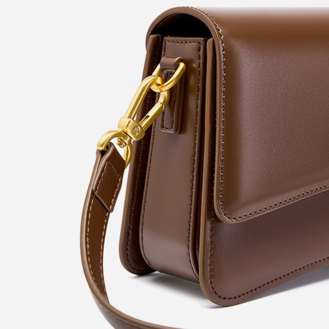 <tc>Bolso bandolera Britney de cuero liso</tc>