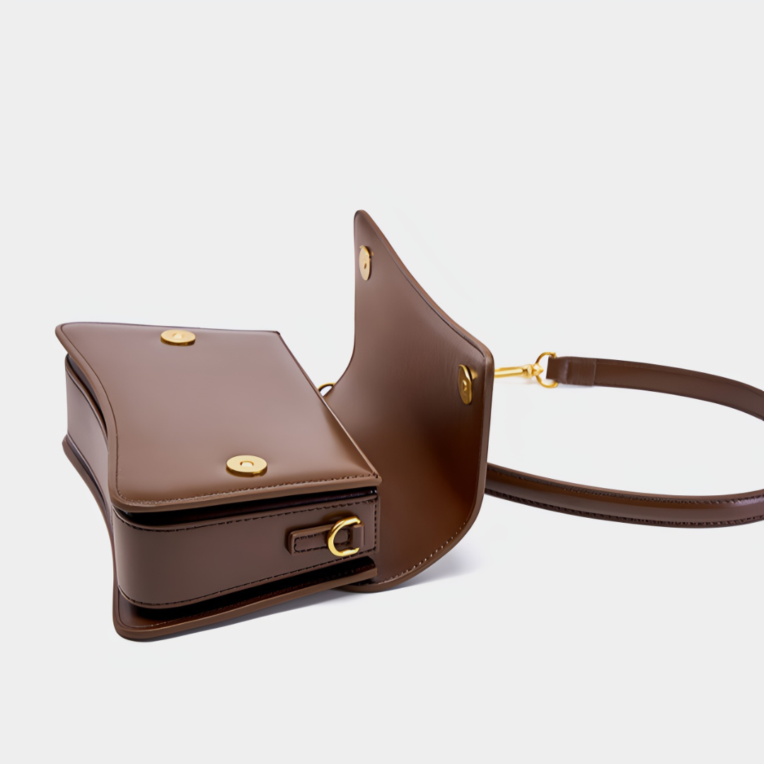 <tc>Bolso bandolera Britney de cuero liso</tc>